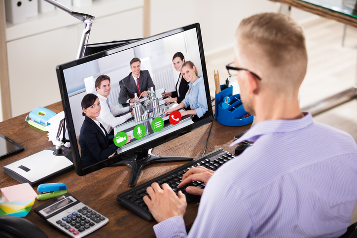 Businessman Video Conferencing On Computer