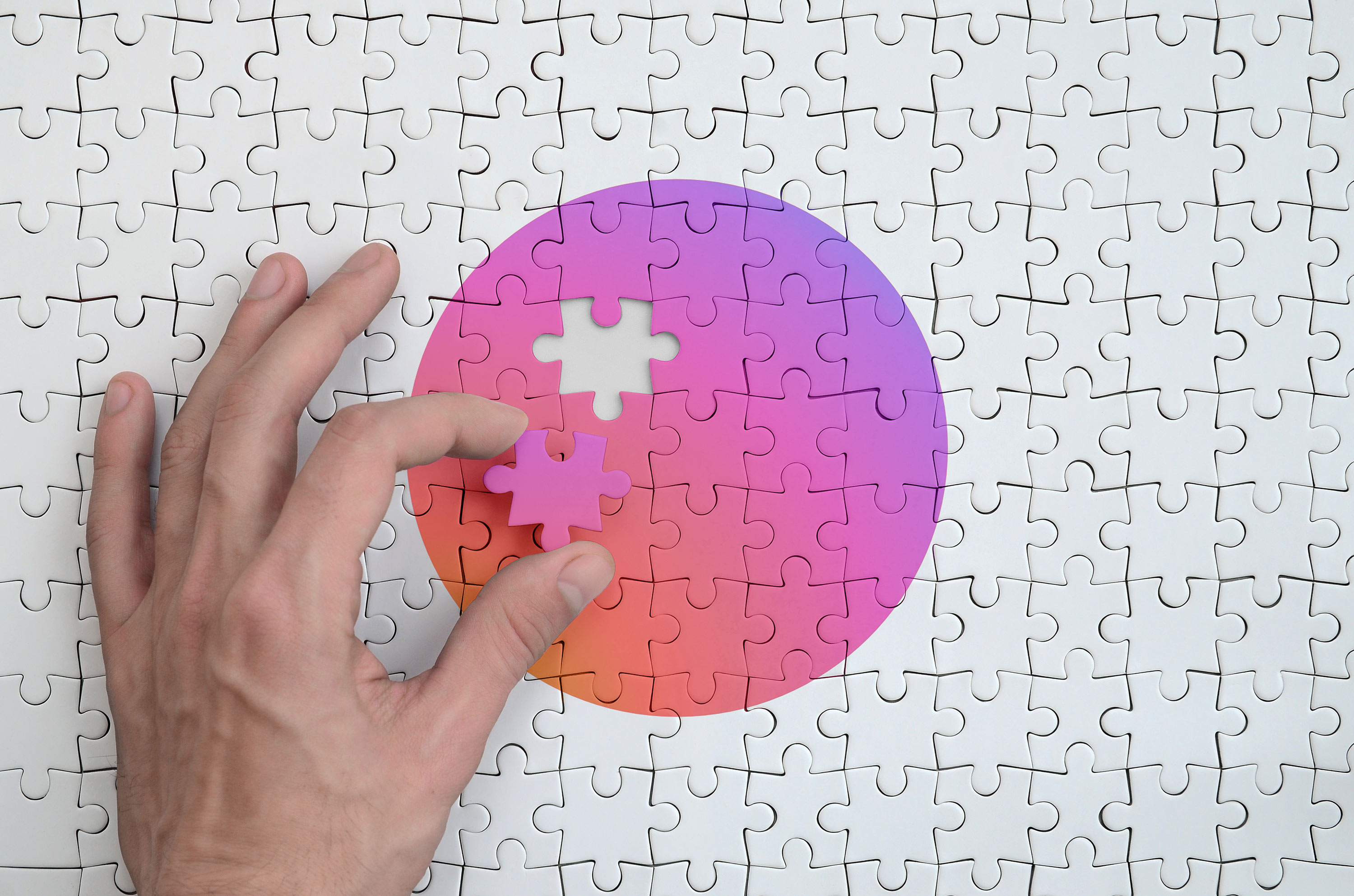 Japan flag  is depicted on a puzzle, which the man's hand completes to fold